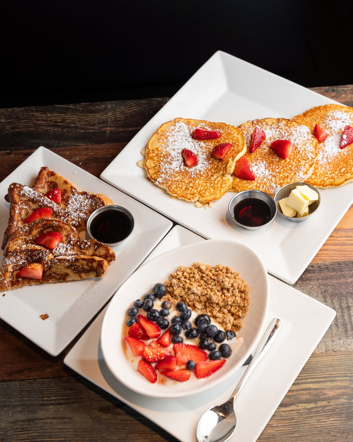 Spectators weekend brunch — French toast, strawberry pancakes, and a yogurt granola bowl